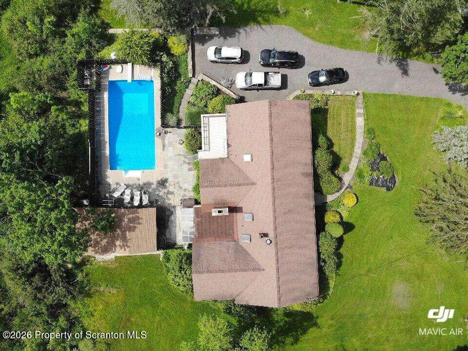 an aerial view of a house with a garden
