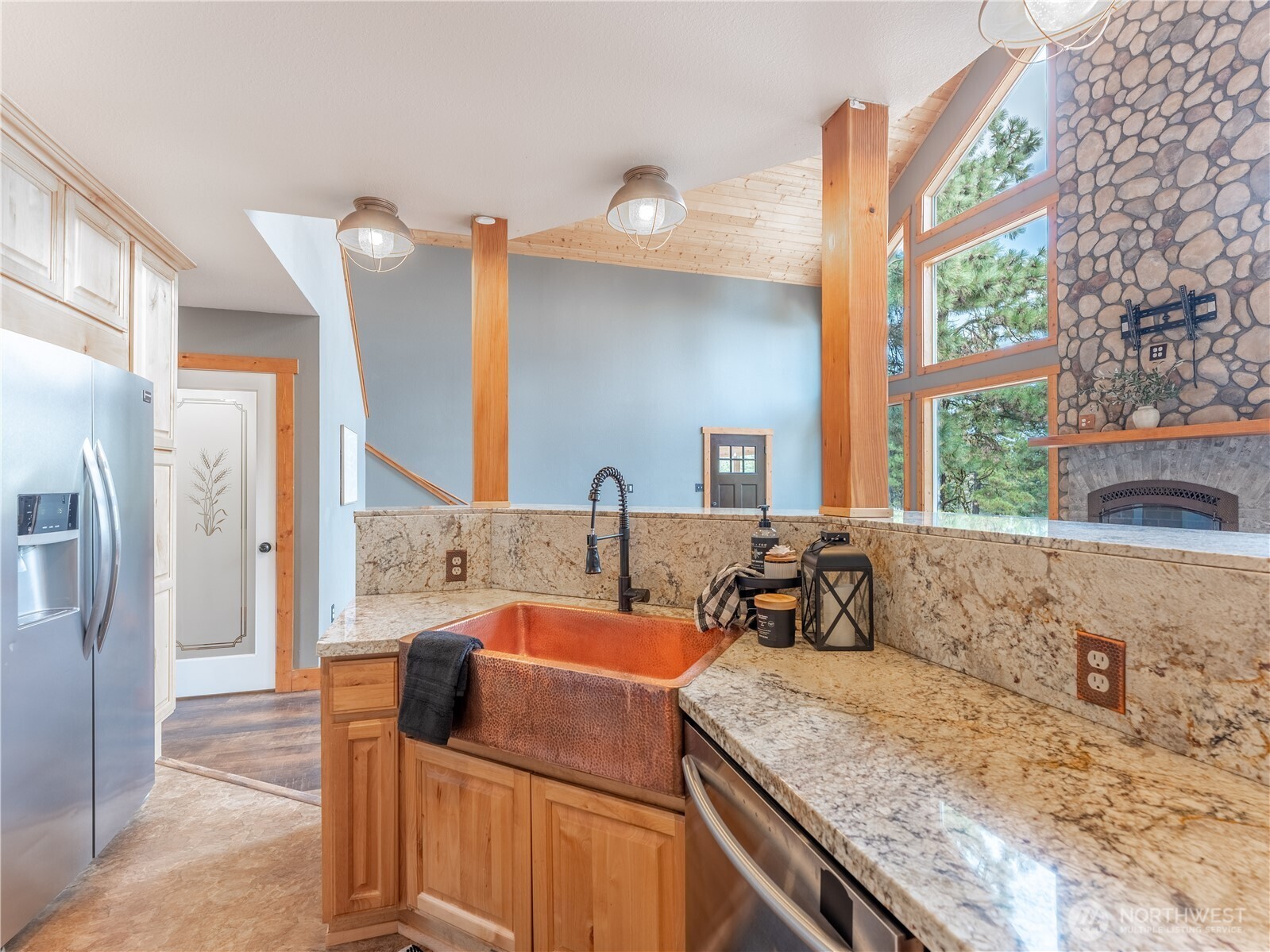 117 Hummingbird Road East Wenatchee, WA 98802 - Photo 12 of 40 a kitchen with a granite countertop sink and a large window