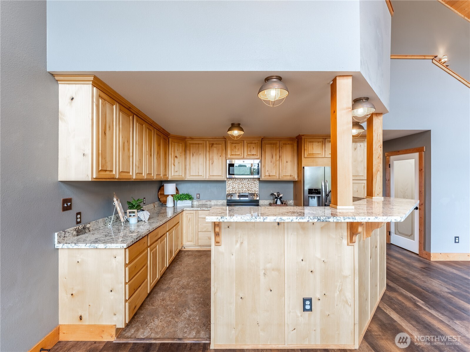 117 Hummingbird Road East Wenatchee, WA 98802 - Photo 9 of 40 a kitchen with a sink a stove cabinets and counter space