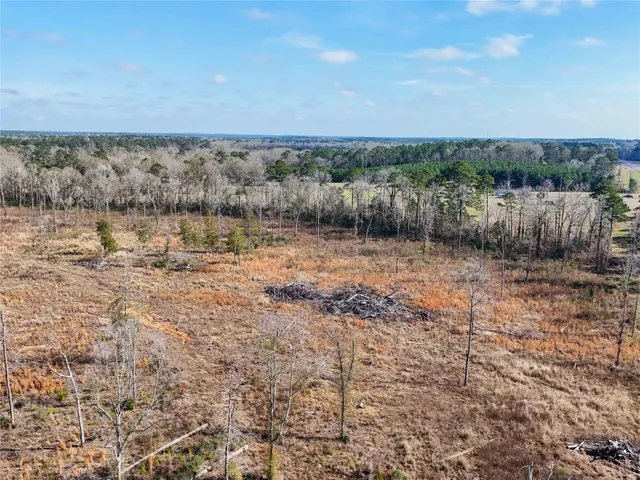 a view of a lake with a yard