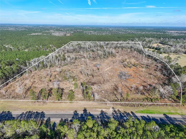 a view of a yard with an ocean view