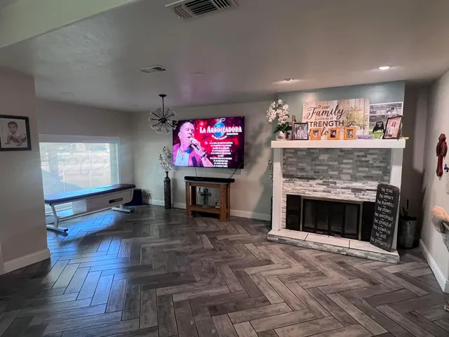 a living room with furniture and a fireplace