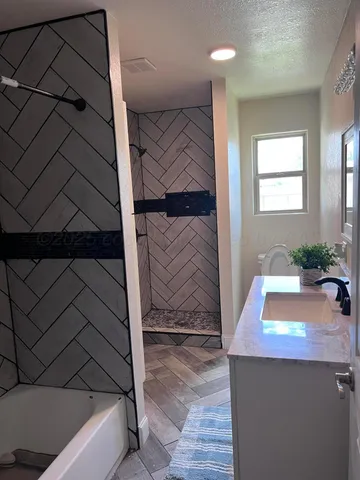 a room with a couch and potted plant