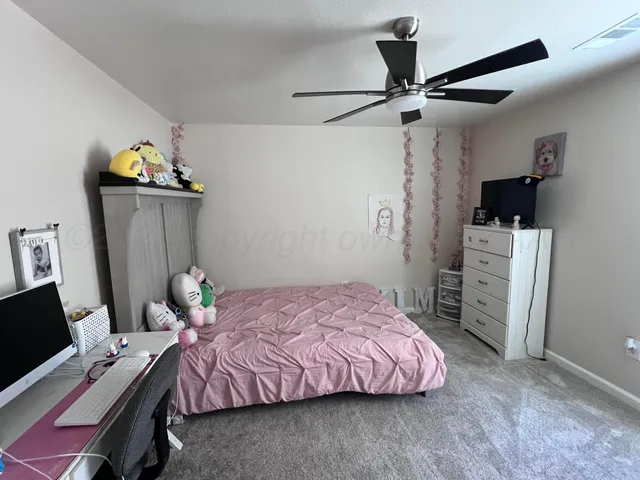 a bedroom with a bed and furniture