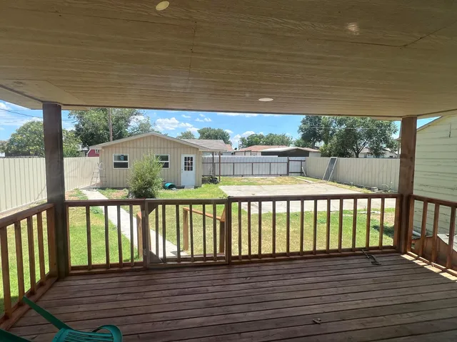a view of balcony with wooden floor