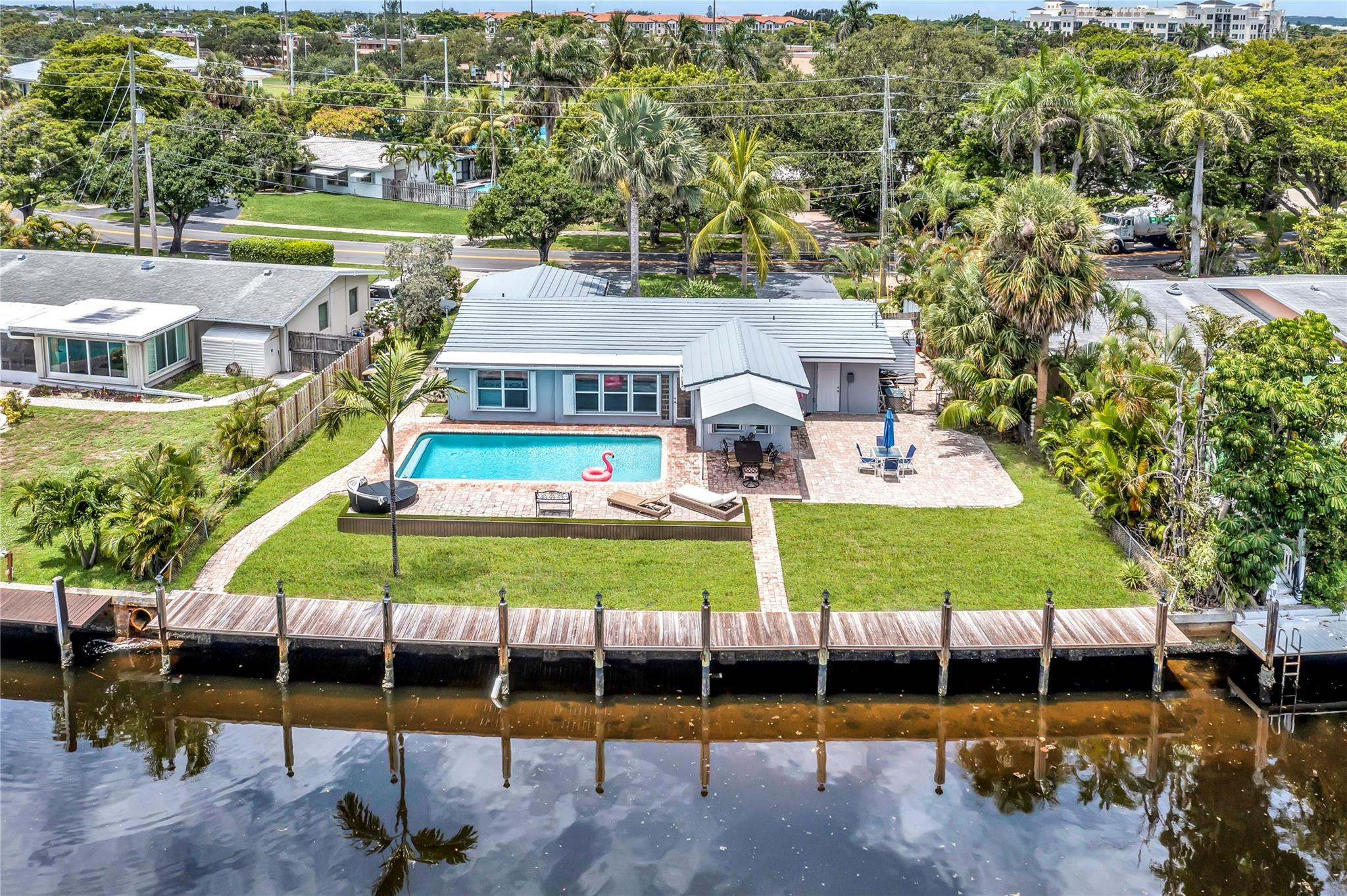 4730 Northeast 22nd Avenue Lighthouse Point, FL 33064 - Photo 1 of 35 an aerial view of a swimming pool and outdoor seating