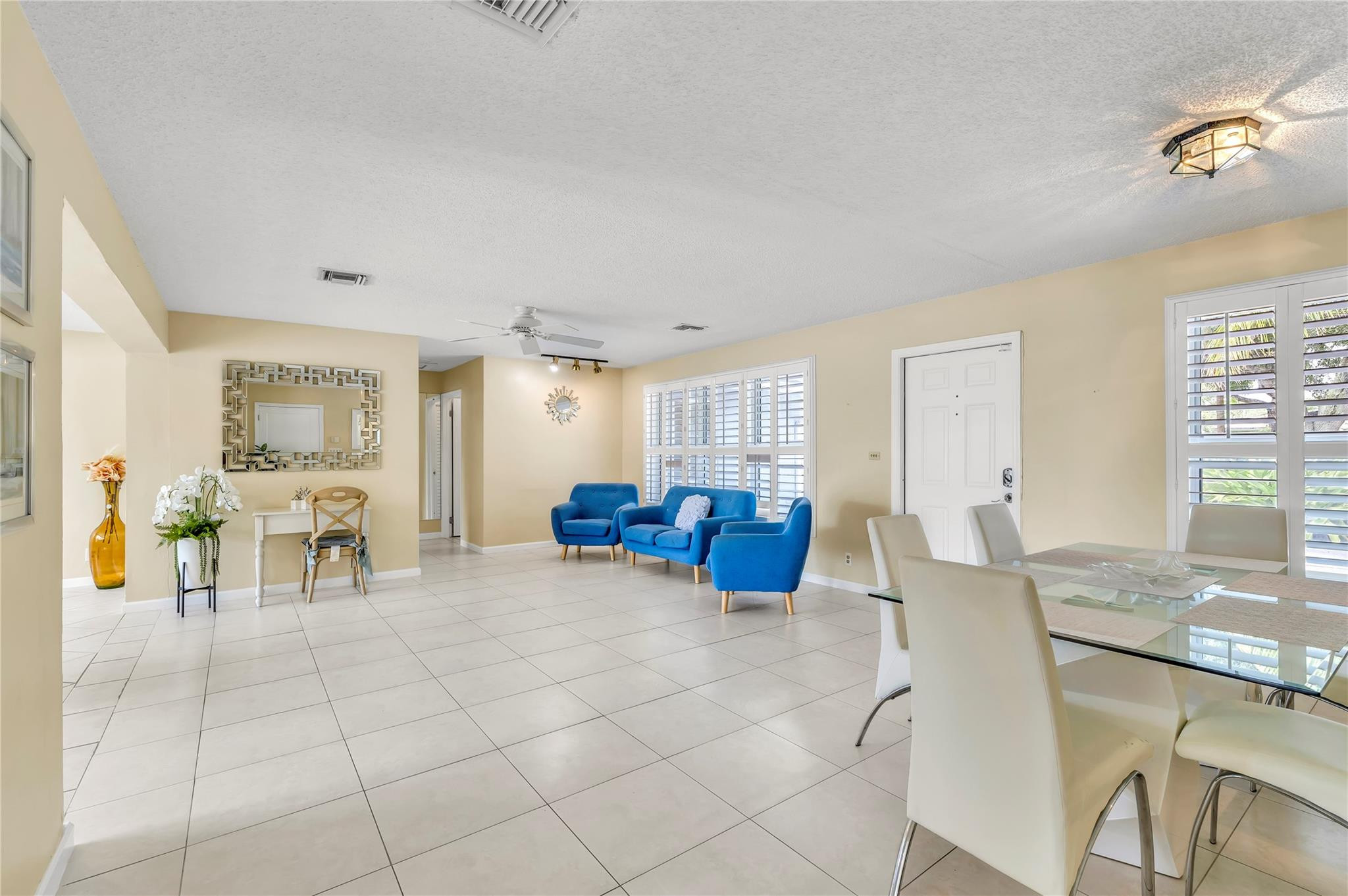4730 Northeast 22nd Avenue Lighthouse Point, FL 33064 - Photo 14 of 35 a view of a livingroom with furniture and a dining table