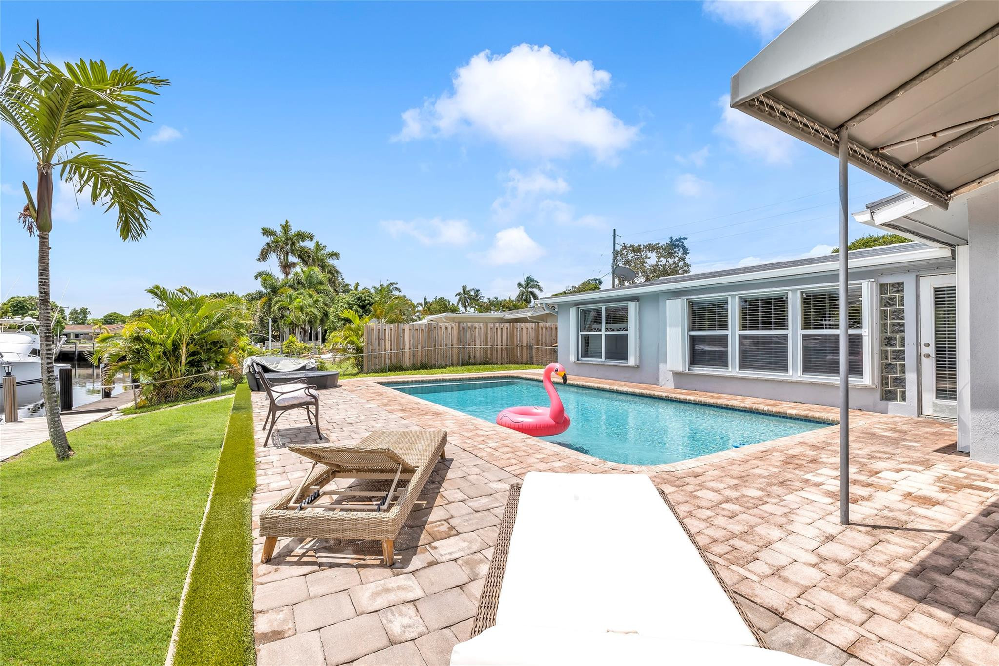 4730 Northeast 22nd Avenue Lighthouse Point, FL 33064 - Photo 26 of 35 a view of a house with backyard porch and sitting area