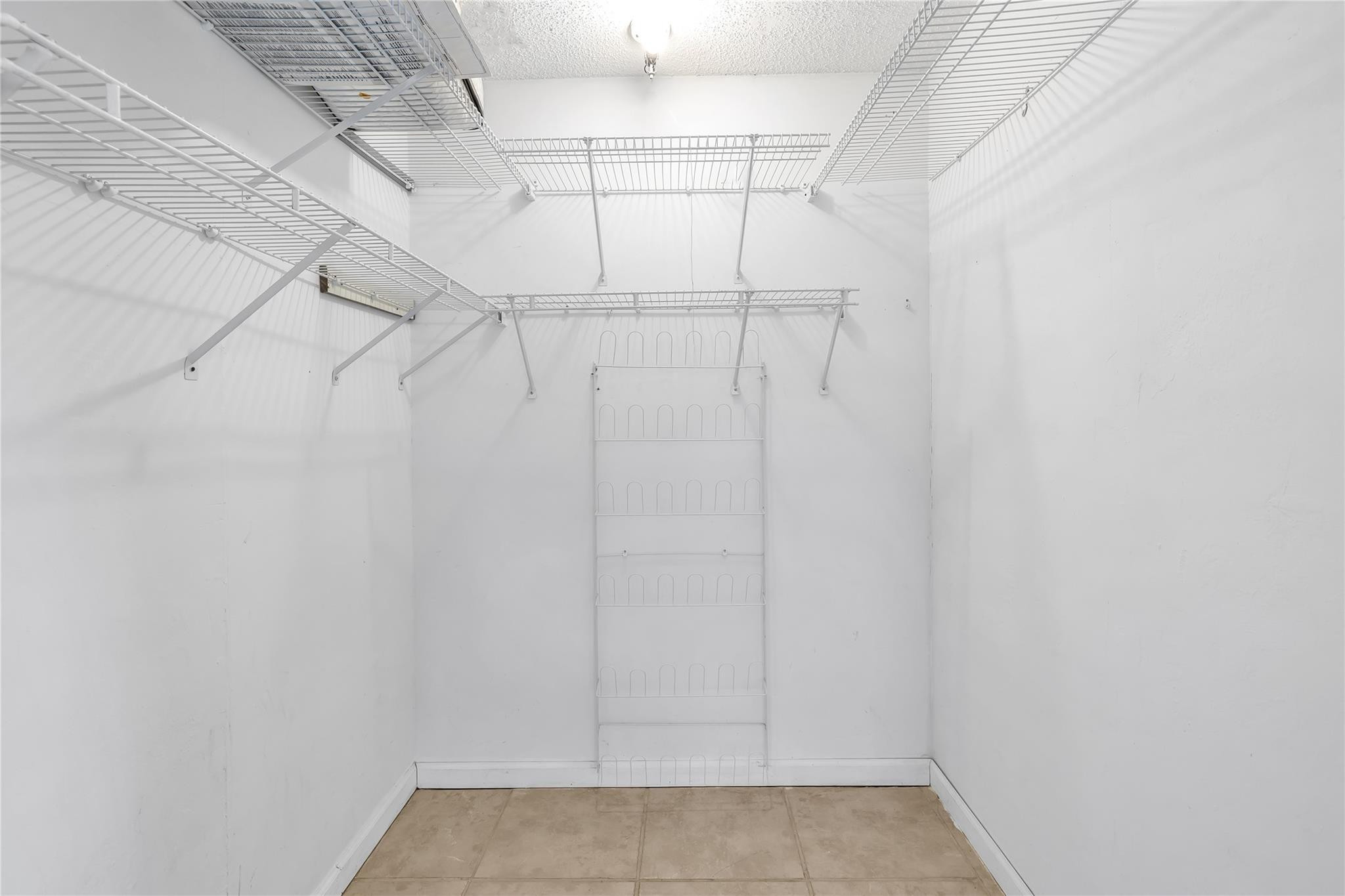 4730 Northeast 22nd Avenue Lighthouse Point, FL 33064 - Photo 31 of 35 a view of a room with racks on the wall