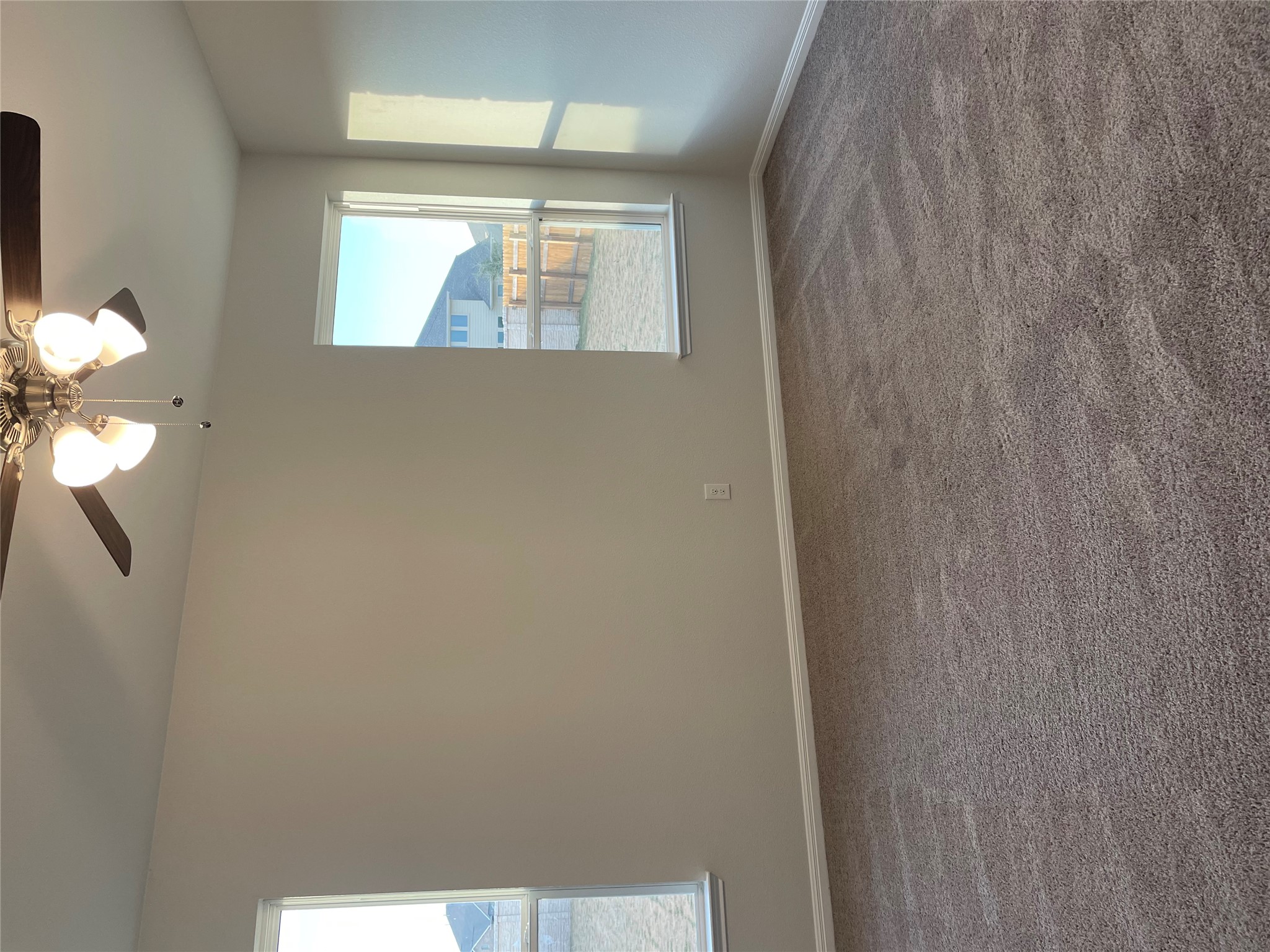 3908 Birdwatch Loop, Unit 56 Pflugerville, TX 78660 - Photo 23 of 30 an empty room with windows and fan
