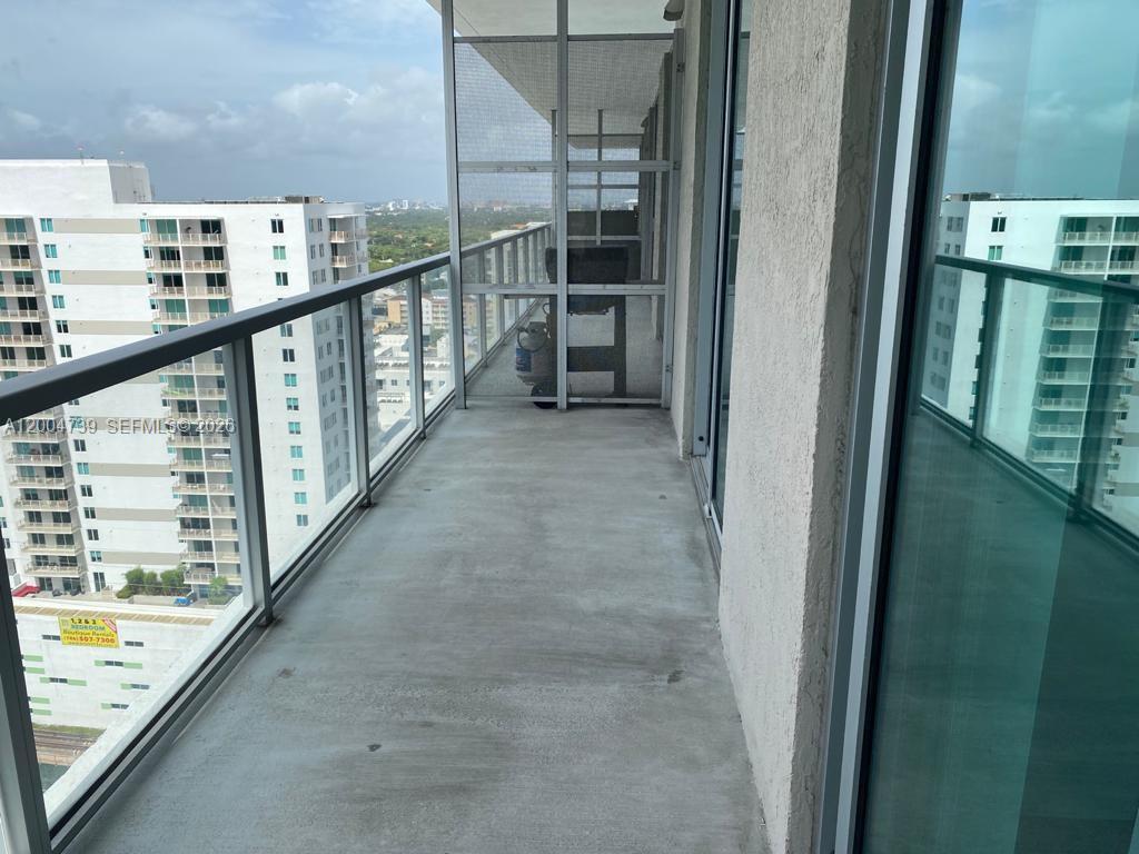 79 Southwest 12th Street, Unit 2403S Miami, FL 33130 - Photo 8 of 12 a view of balcony with wooden floor