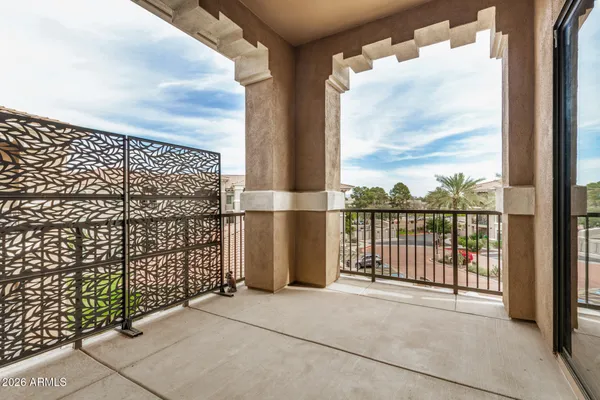 a view of a balcony with city view