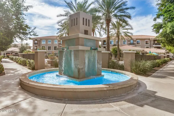 a view of a house with a fountain