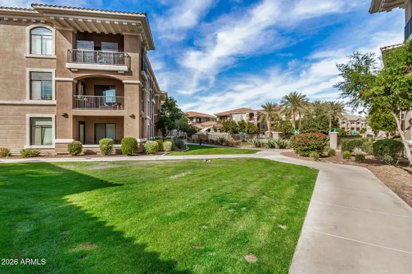 a front view of a building with garden