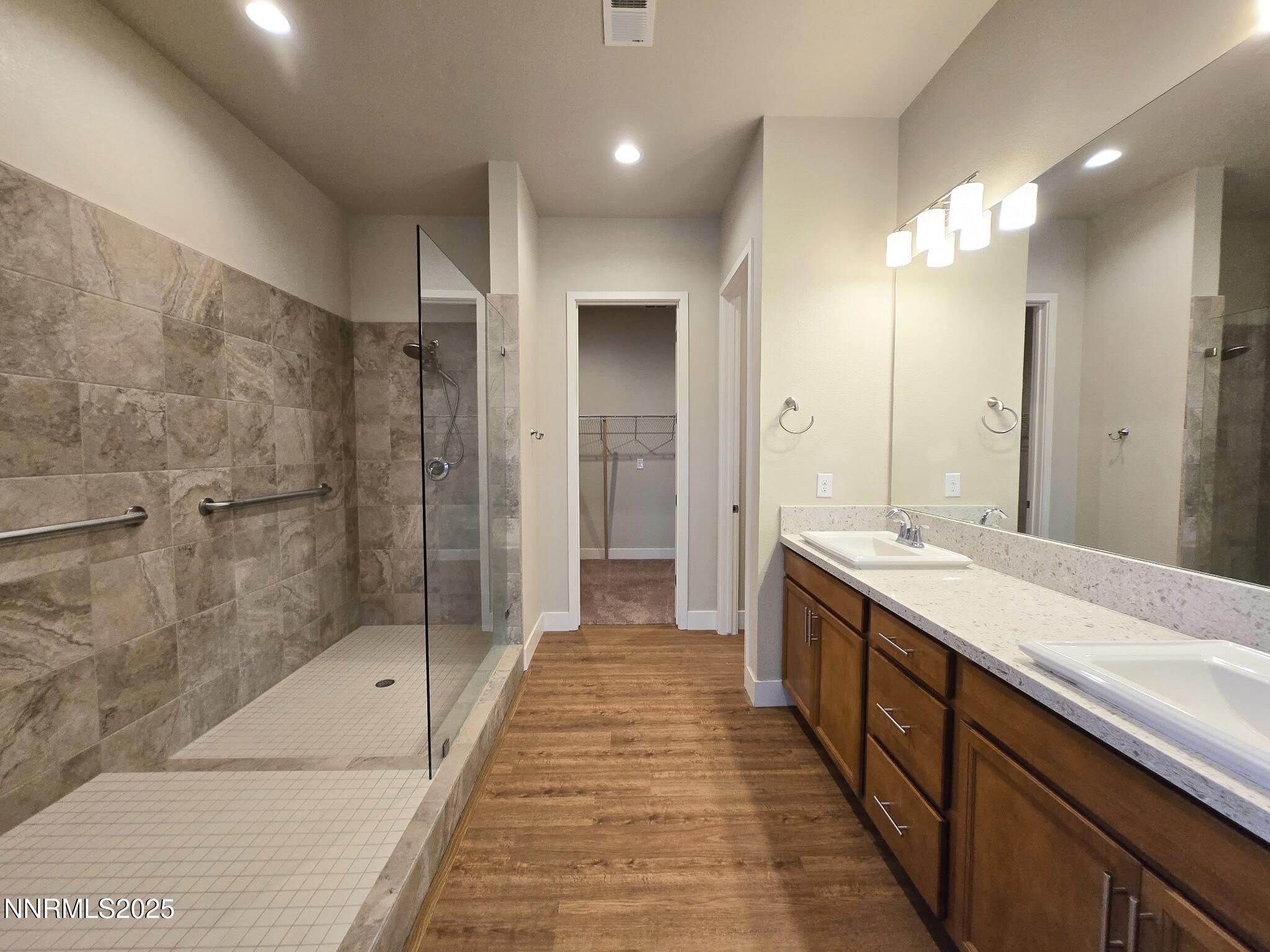 162 Jennys Lane Fernley, NV 89408 - Photo 15 of 39 a spacious bathroom with a shower and a sink
