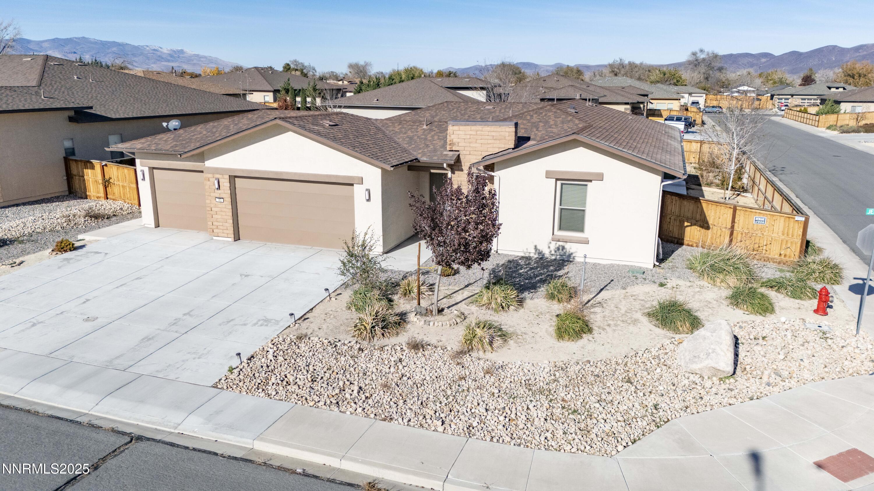 162 Jennys Lane Fernley, NV 89408 - Photo 2 of 39 a view of a white house with a outdoor space