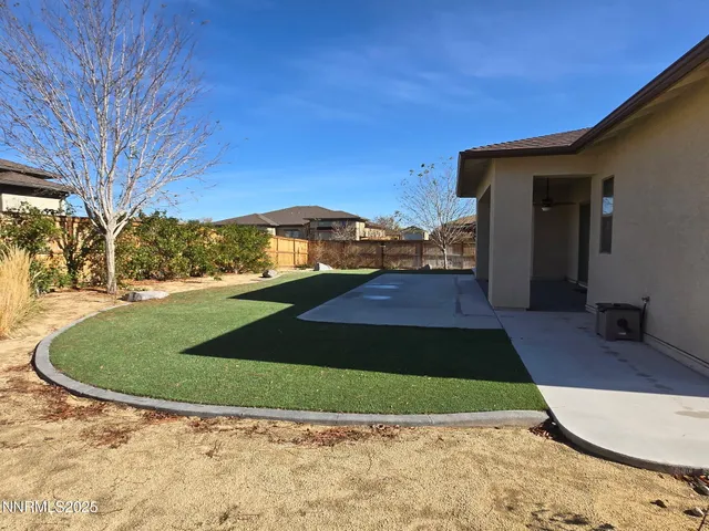 an aerial view of a house with a swimming pool