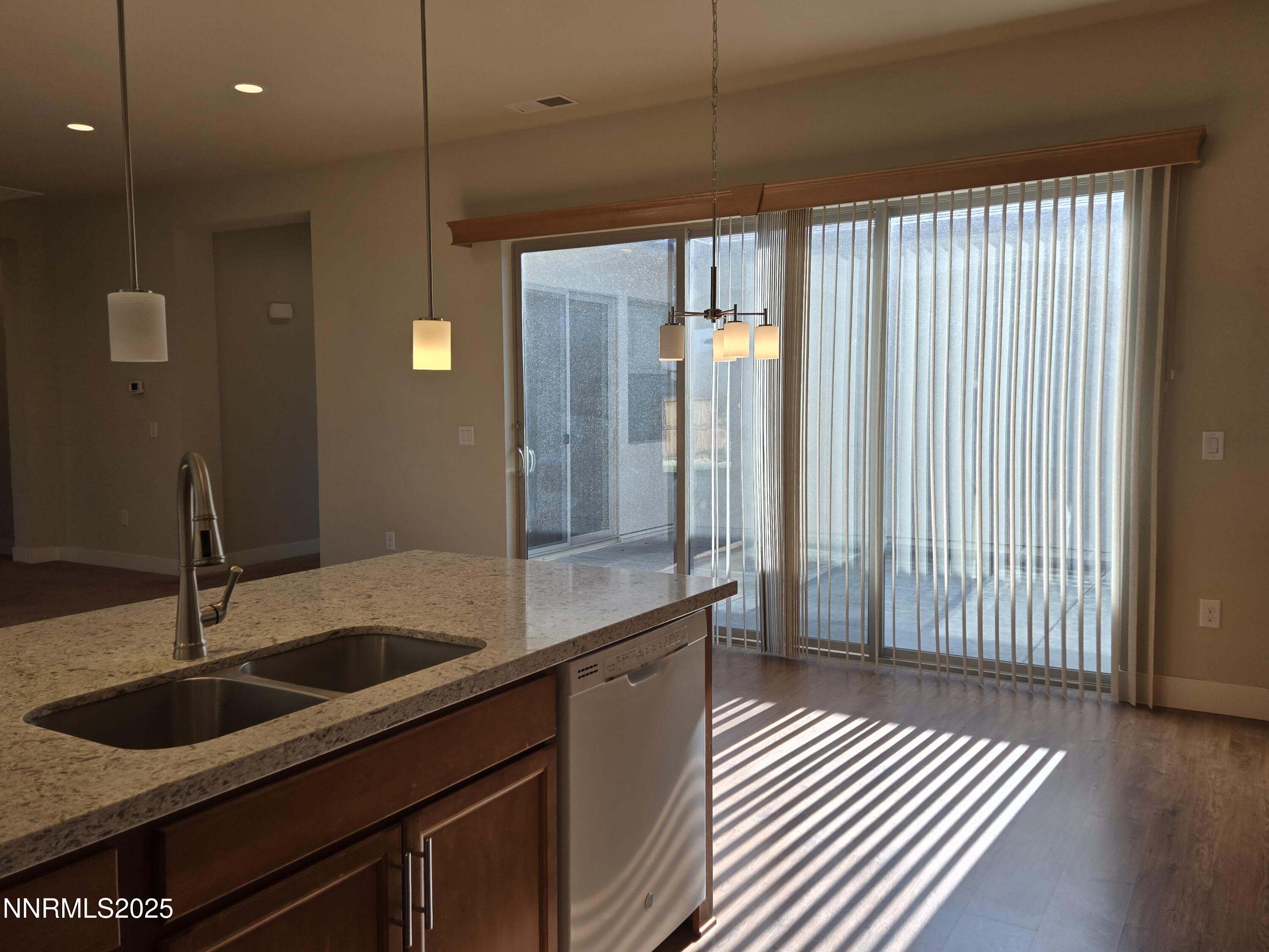 162 Jennys Lane Fernley, NV 89408 - Photo 7 of 39 a kitchen with a sink and wooden floor