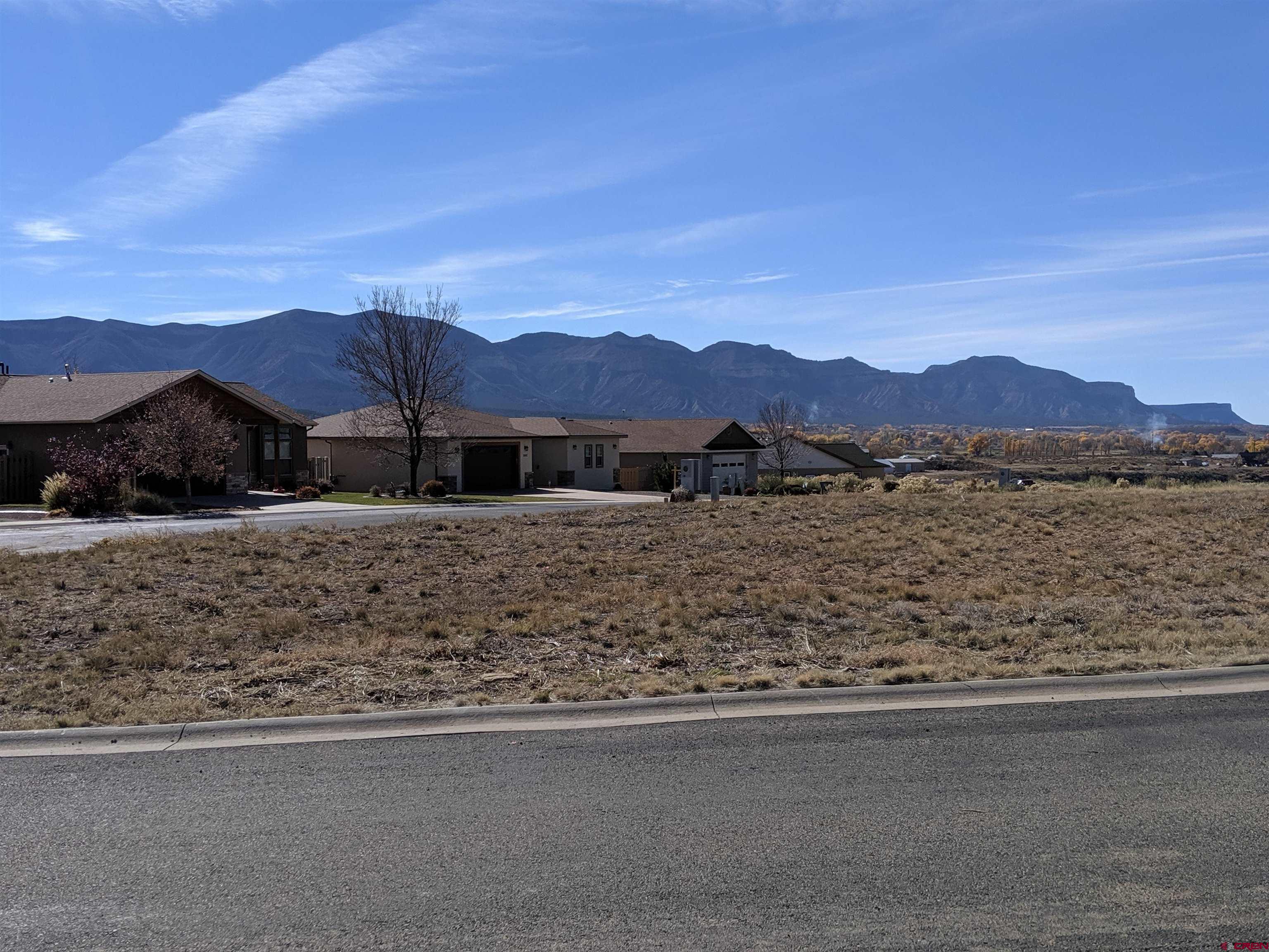 718 Lois Lane Cortez, CO 81321 - Photo 2 of 7 a view of a house with a lake view