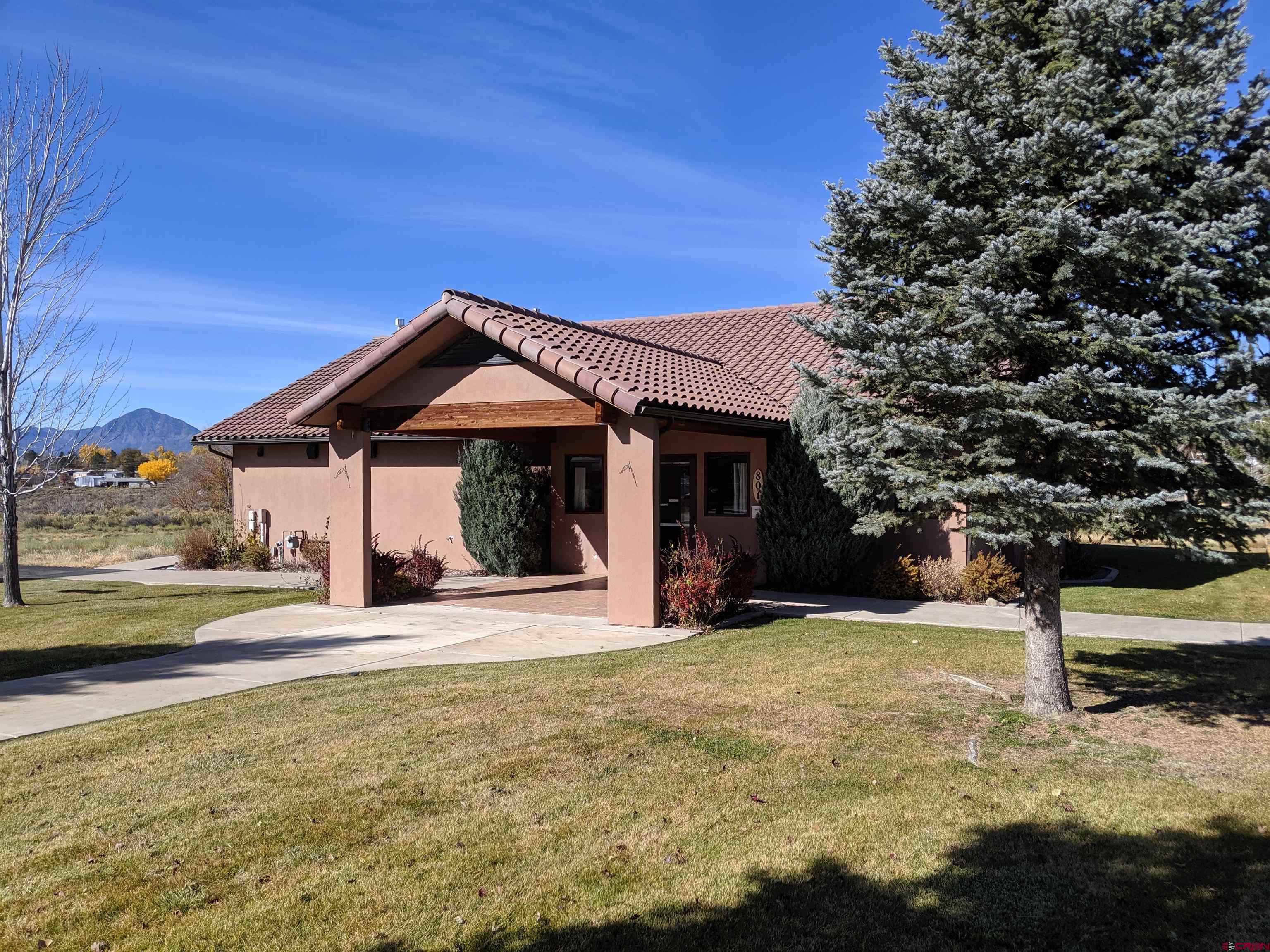 718 Lois Lane Cortez, CO 81321 - Photo 7 of 7 a front view of a house with a yard