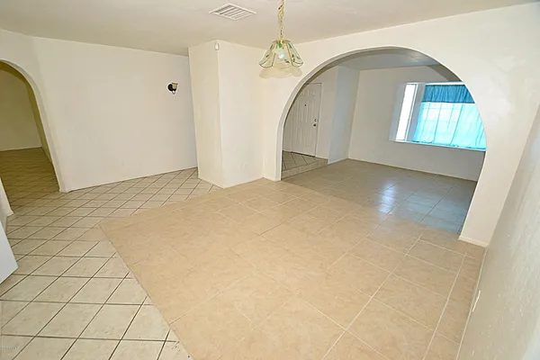 a view of an empty room and window