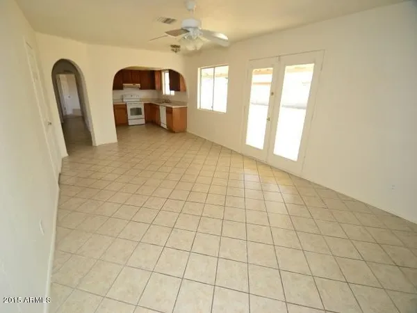 a kitchen with a sink a stove and a refrigerator