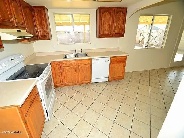 a view of a big room with wooden floor and cabinet