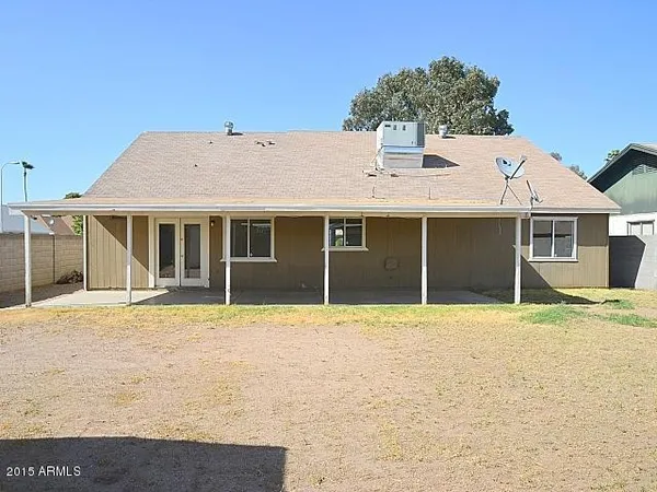 a house with a wooden fence