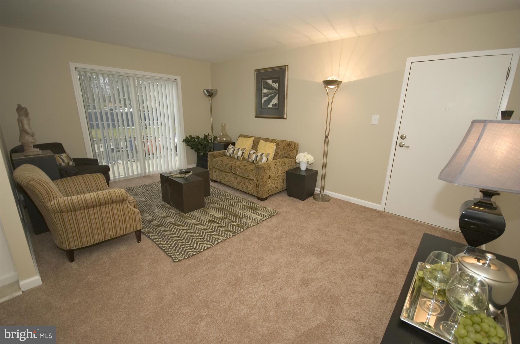 2351 16th Street Southeast, Unit 302 Washington, DC 20020 - Photo 1 of 27 a living room with furniture and a window