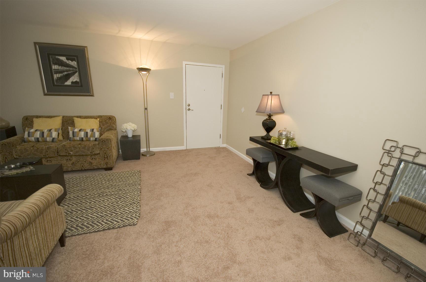 2351 16th Street Southeast, Unit 302 Washington, DC 20020 - Photo 11 of 27 a bedroom with furniture and a gym equipment