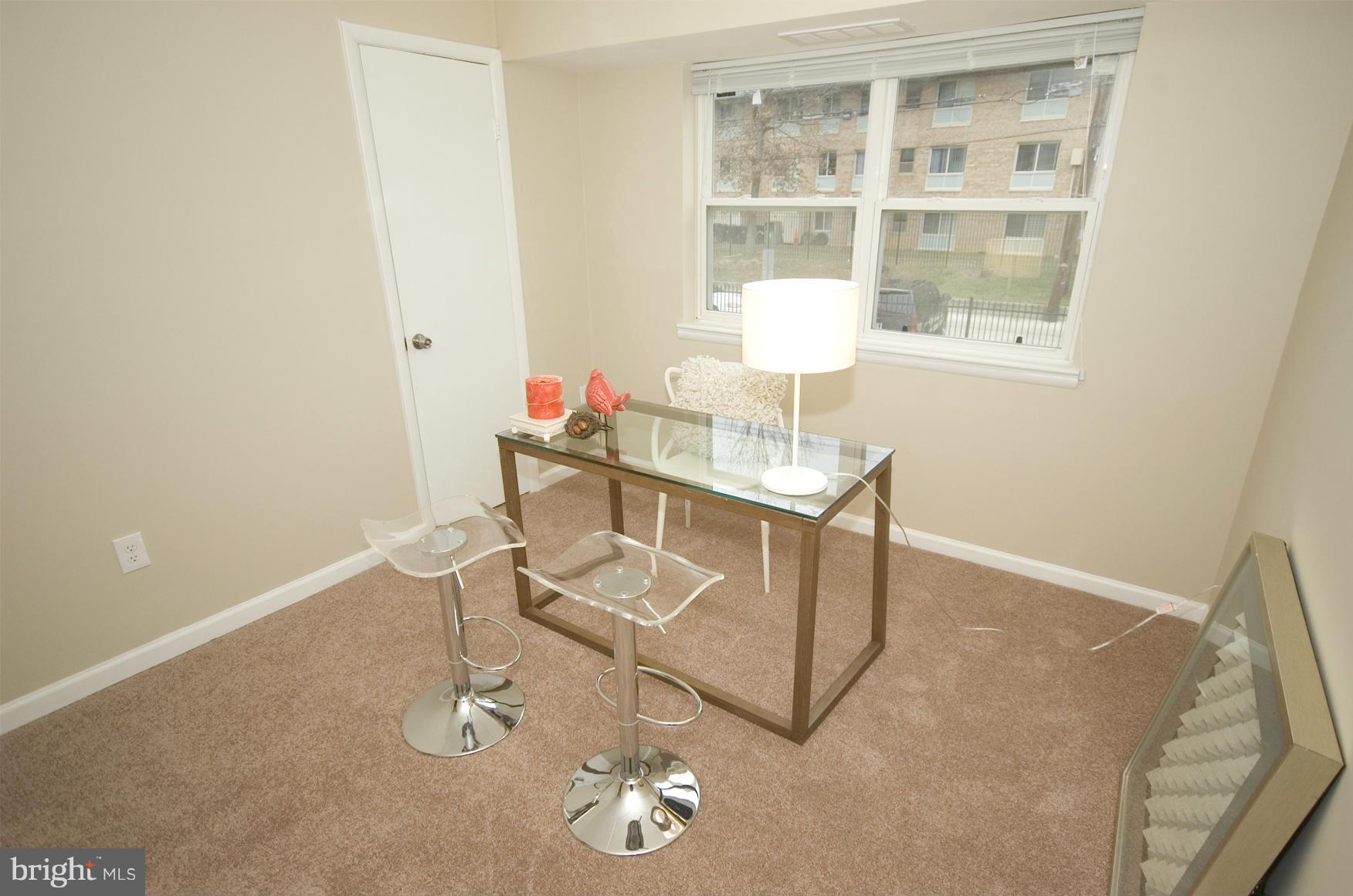 2351 16th Street Southeast, Unit 302 Washington, DC 20020 - Photo 17 of 27 a workspace with furniture and a window