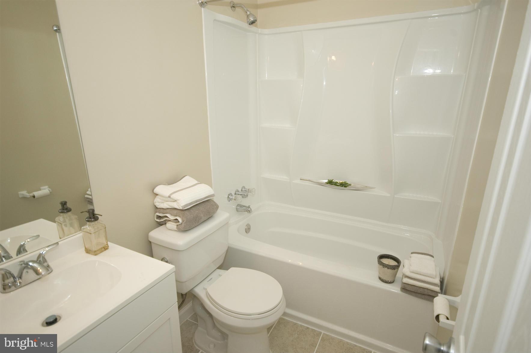 2351 16th Street Southeast, Unit 302 Washington, DC 20020 - Photo 20 of 27 a bathroom with a sink a toilet and shower