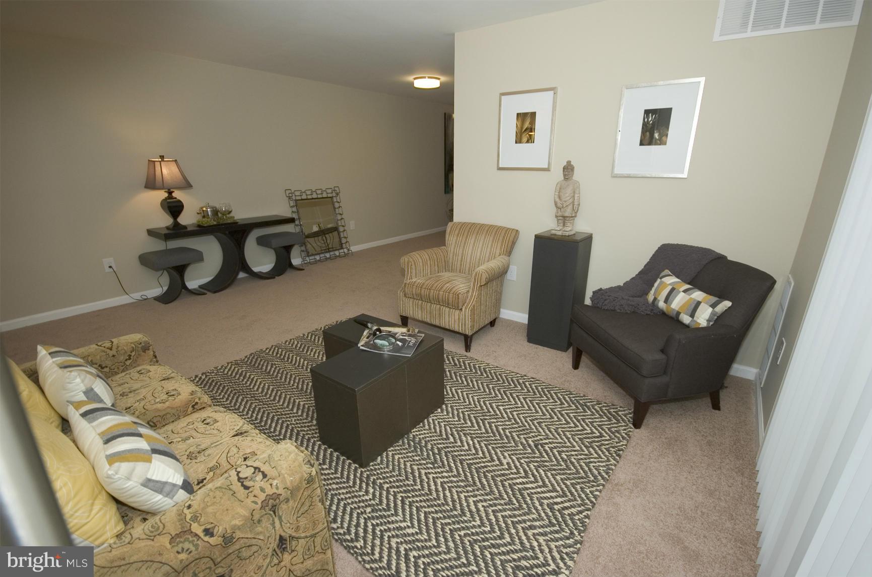 2351 16th Street Southeast, Unit 302 Washington, DC 20020 - Photo 10 of 27 a living room with furniture and a couch