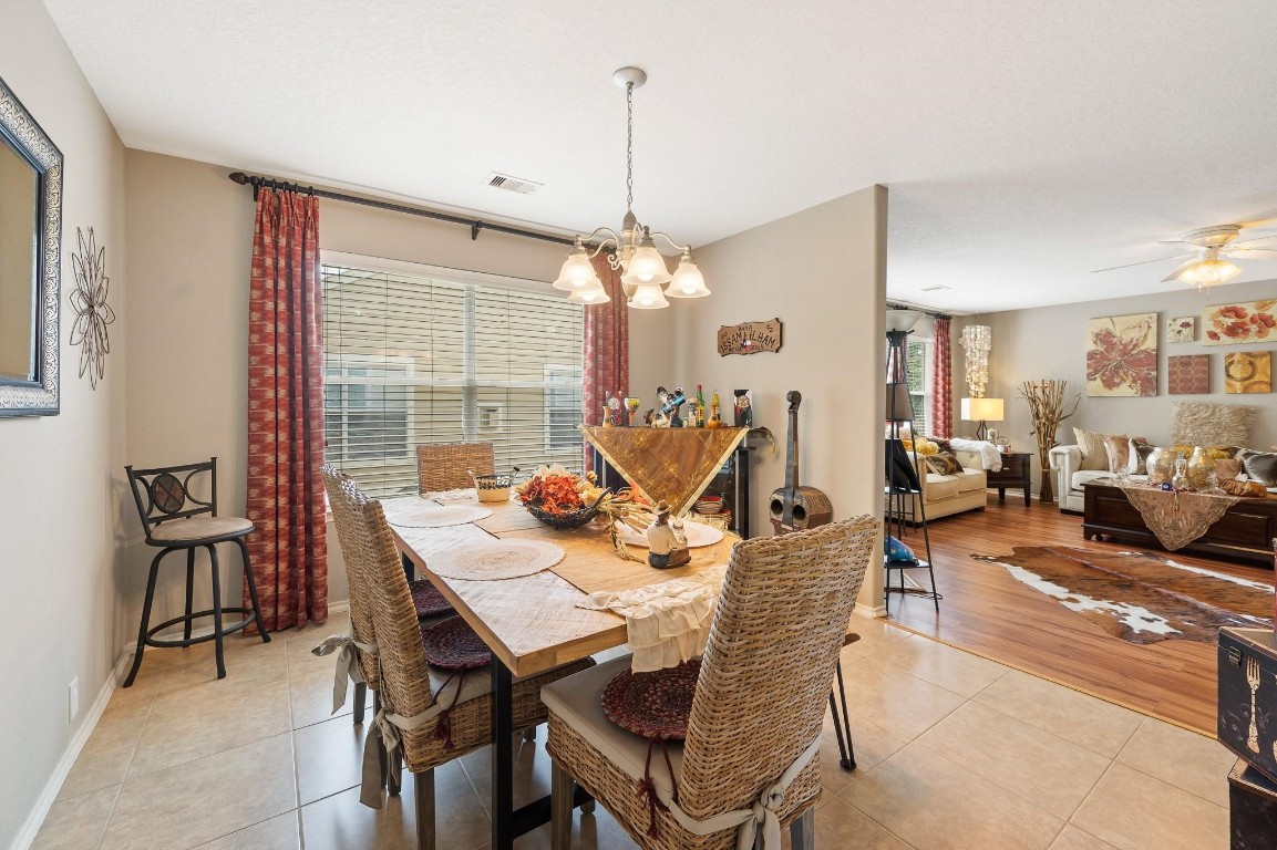 13600 Breton Ridge Street, Unit 25E Houston, TX 77070 - Photo 11 of 39 a view of a dining room with furniture window and outside view