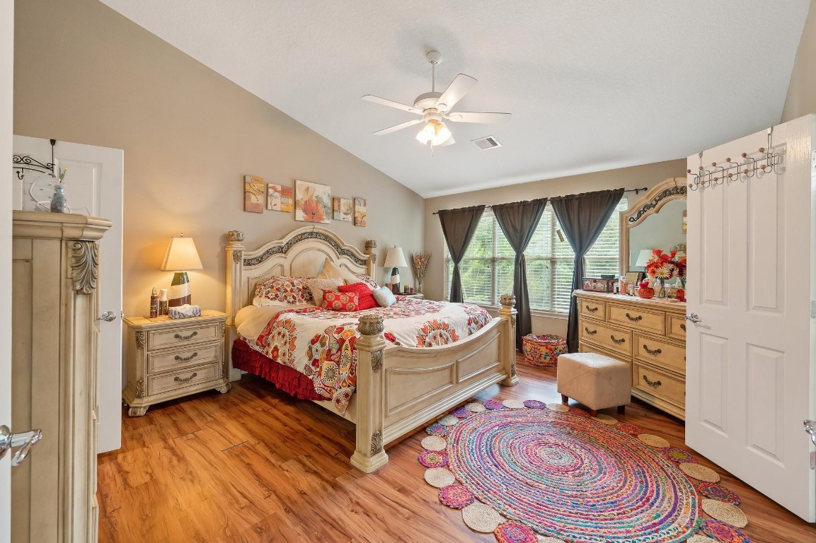 13600 Breton Ridge Street, Unit 25E Houston, TX 77070 - Photo 16 of 39 a bedroom with a bed and a window