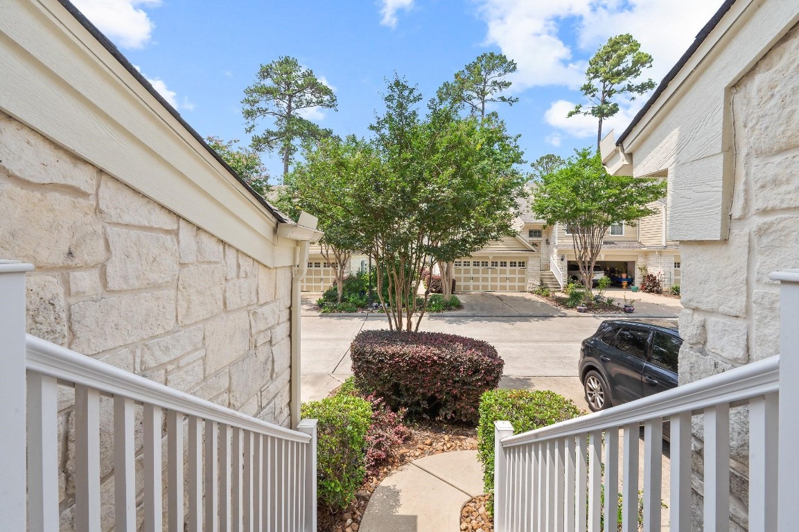 13600 Breton Ridge Street, Unit 25E Houston, TX 77070 - Photo 2 of 39 a view of a house with backyard and sitting area