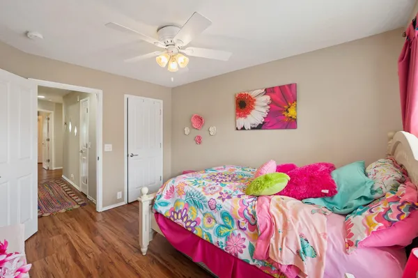 a bedroom with a bed and a chandelier