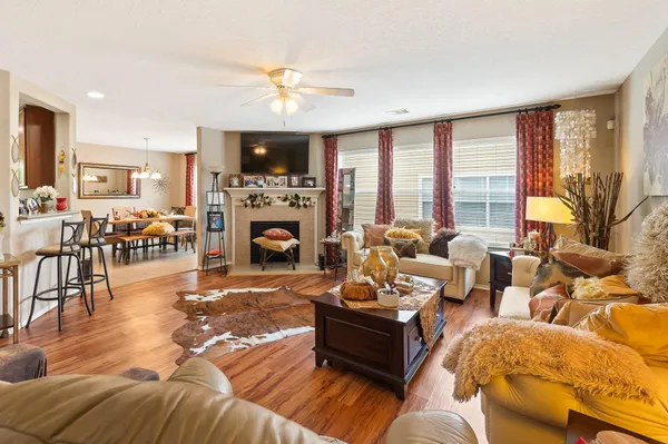 a living room with furniture large window and outdoor view