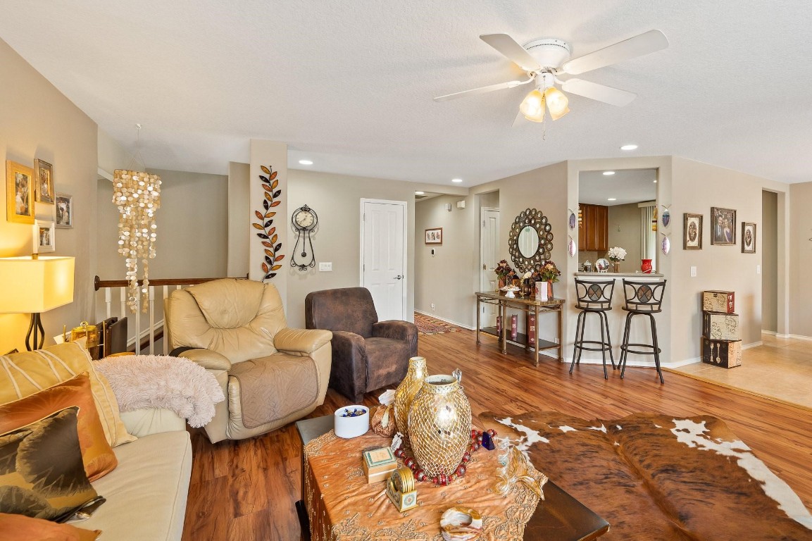 13600 Breton Ridge Street, Unit 25E Houston, TX 77070 - Photo 9 of 39 a living room with furniture and wooden floor