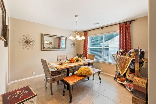 a view of a dining room with furniture window and outside view