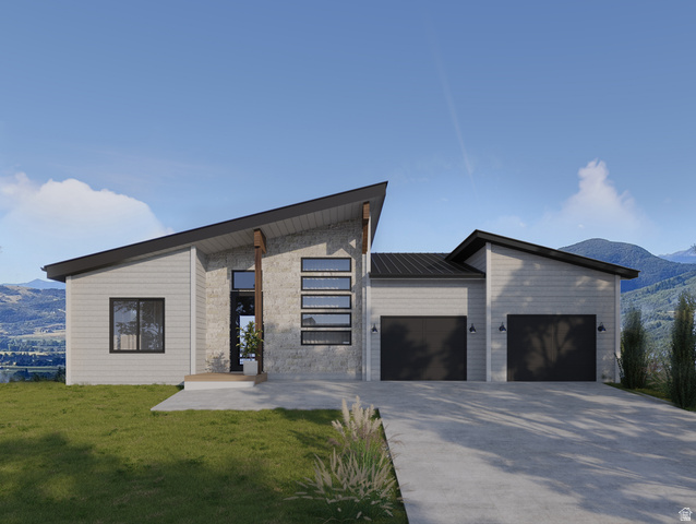 4716 East Howe Drive, Unit 252 Eden, UT 84310 - Photo 1 of 3 Contemporary house with a mountain view, a garage, driveway, a metal roof, and a front yard