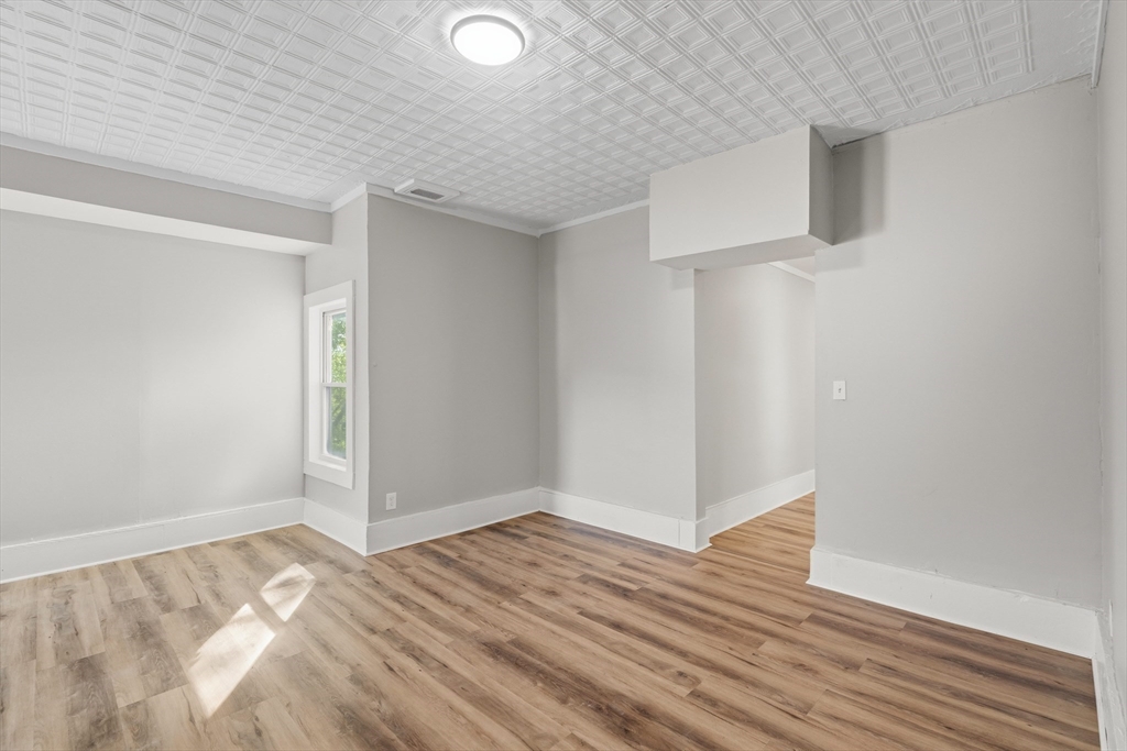 834 Worthington Street, Unit 2 Springfield, MA 01105 - Photo 2 of 20 wooden floor in an empty room
