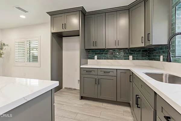 a view of a living room with a hallway