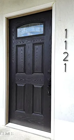 a spacious bathroom with a double vanity sink and a large mirror
