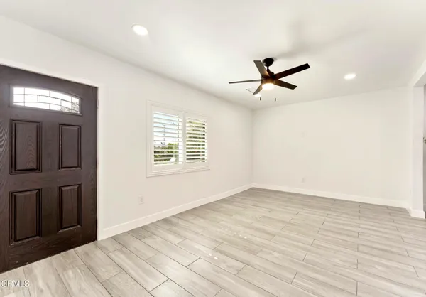 a view of entryway with wooden floor