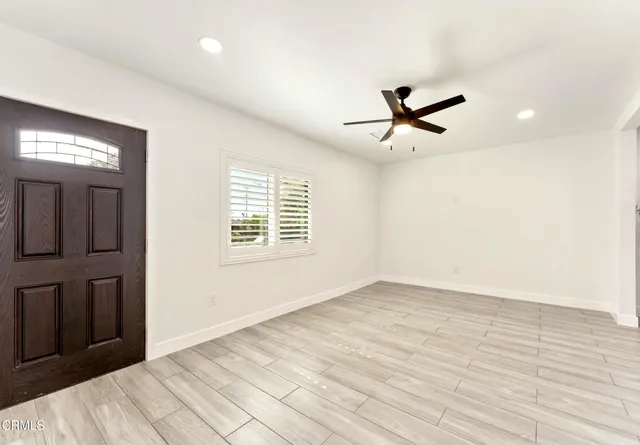 a view of entryway with wooden floor