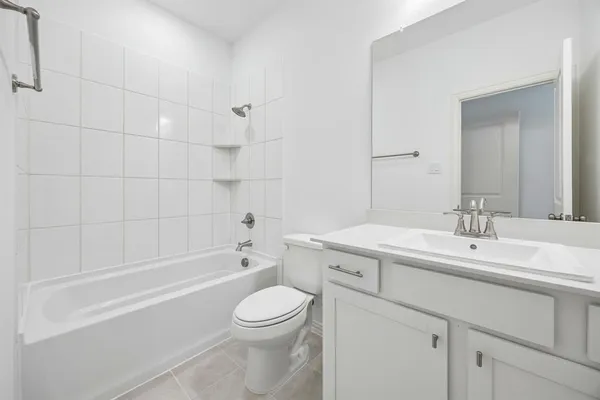 a bathroom with a sink a toilet and bathtub