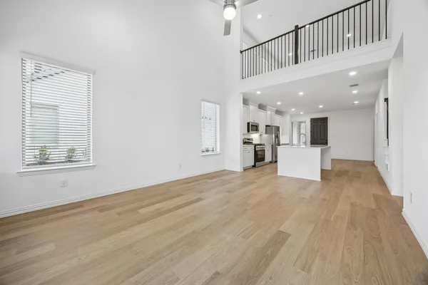a view of a kitchen with a sink and a window