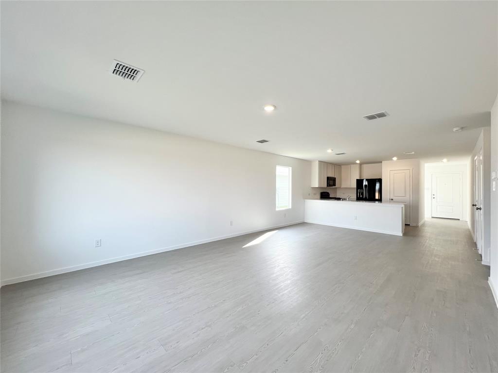 4012 Twinleaf Drive Crowley, TX 76036 - Photo 13 of 39 a view of a kitchen with a sink and a refrigerator