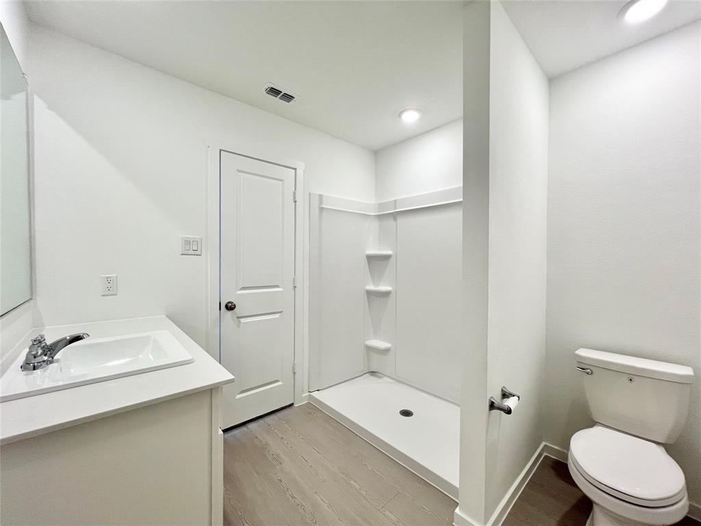 4012 Twinleaf Drive Crowley, TX 76036 - Photo 18 of 39 a bathroom with a sink a toilet and shower